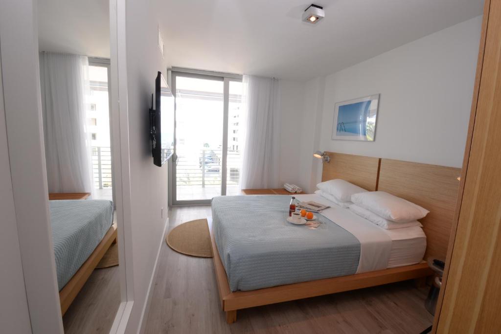 Postel nebo postele na pokoji v ubytování 6080 Design Hotel by Eskape Collection