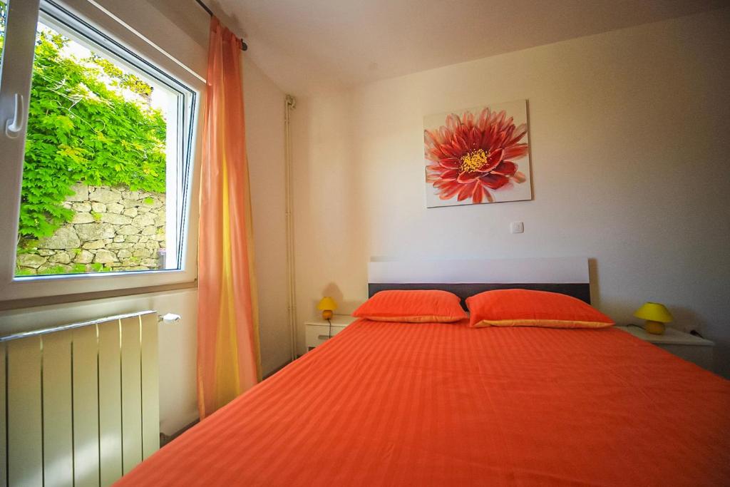 Postel nebo postele na pokoji v ubytování Apartman Carmen Volosko