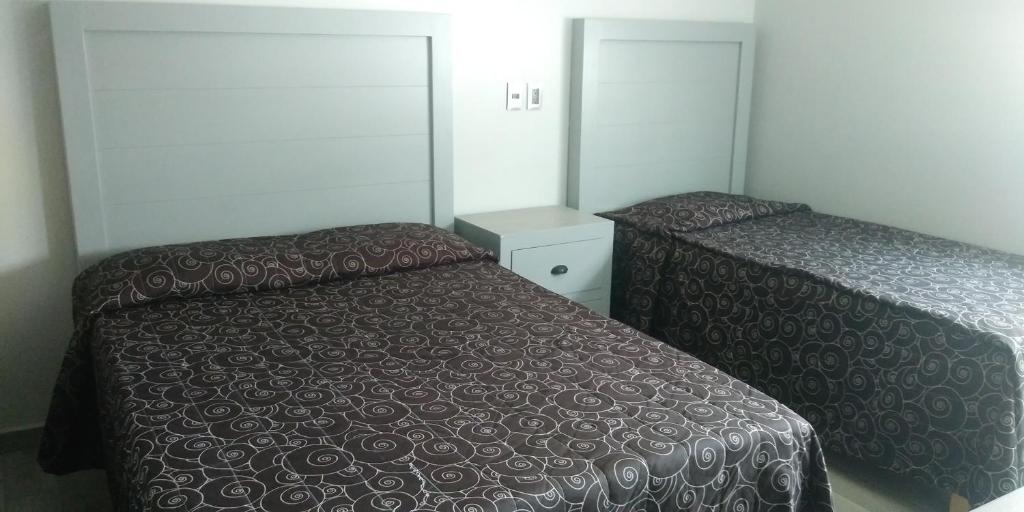 Postel nebo postele na pokoji v ubytování Hotel Colon Express