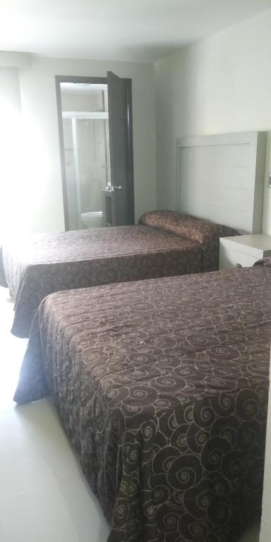Postel nebo postele na pokoji v ubytování Hotel Colon Express