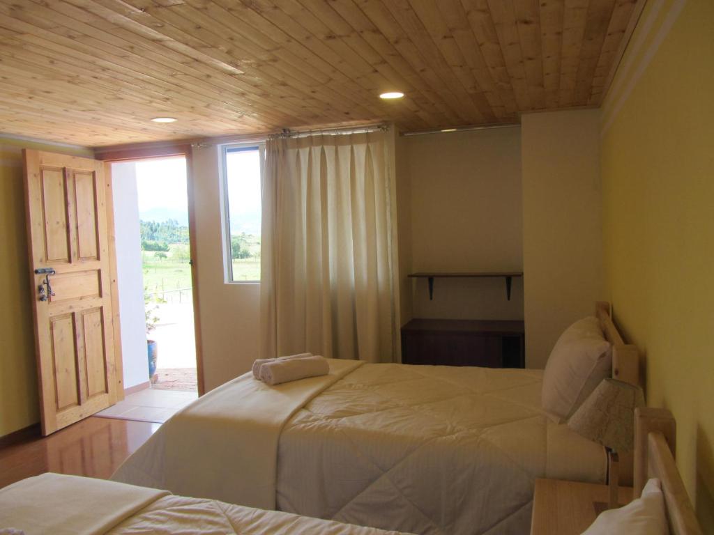 Postel nebo postele na pokoji v ubytování Ecohotel, Finca Colinas y Senderos