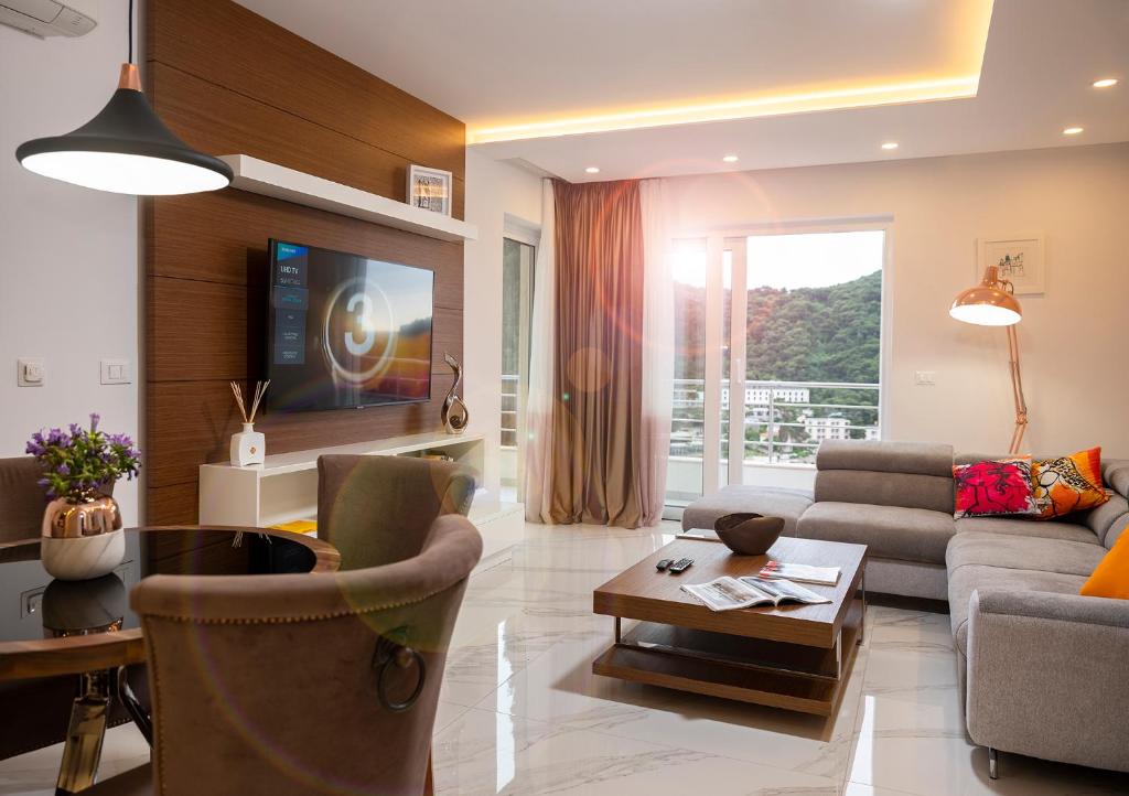 a living room with a couch and a table at Luxury Apartment Mr. Perfect in Dubrovnik