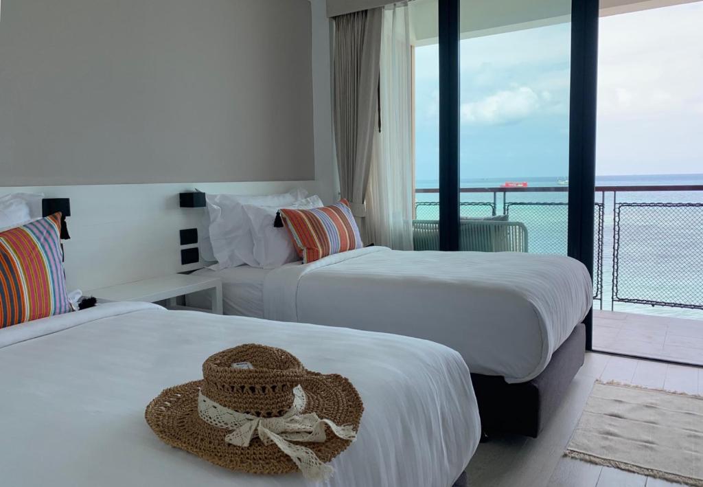 Postel nebo postele na pokoji v ubytování Blue Tao Beach Hotel - SHA Plus