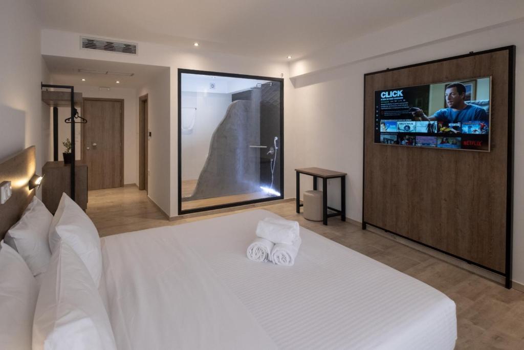 En eller flere senge i et værelse på Sette Suites & Rooms - Adults Only