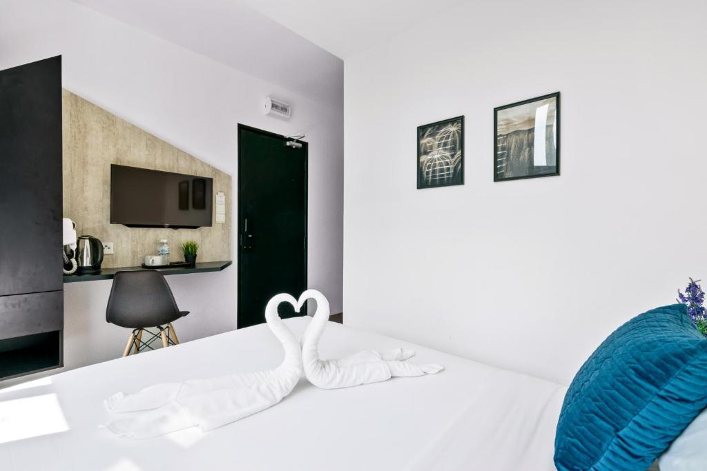 Postel nebo postele na pokoji v ubytování Rica Hotel Usj