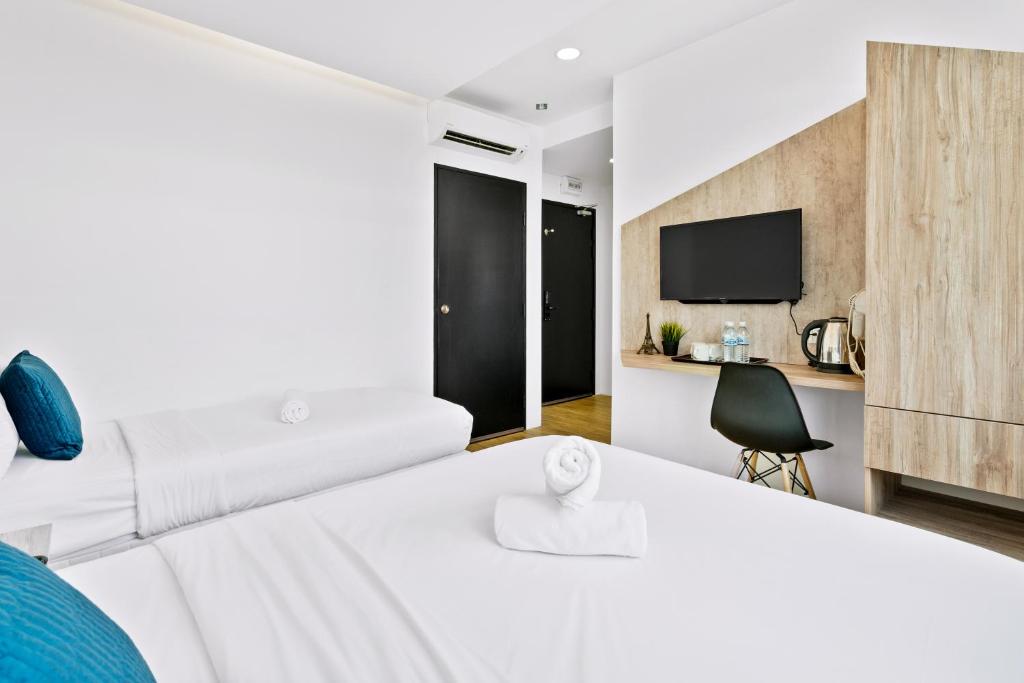 Postel nebo postele na pokoji v ubytování Rica Hotel Usj