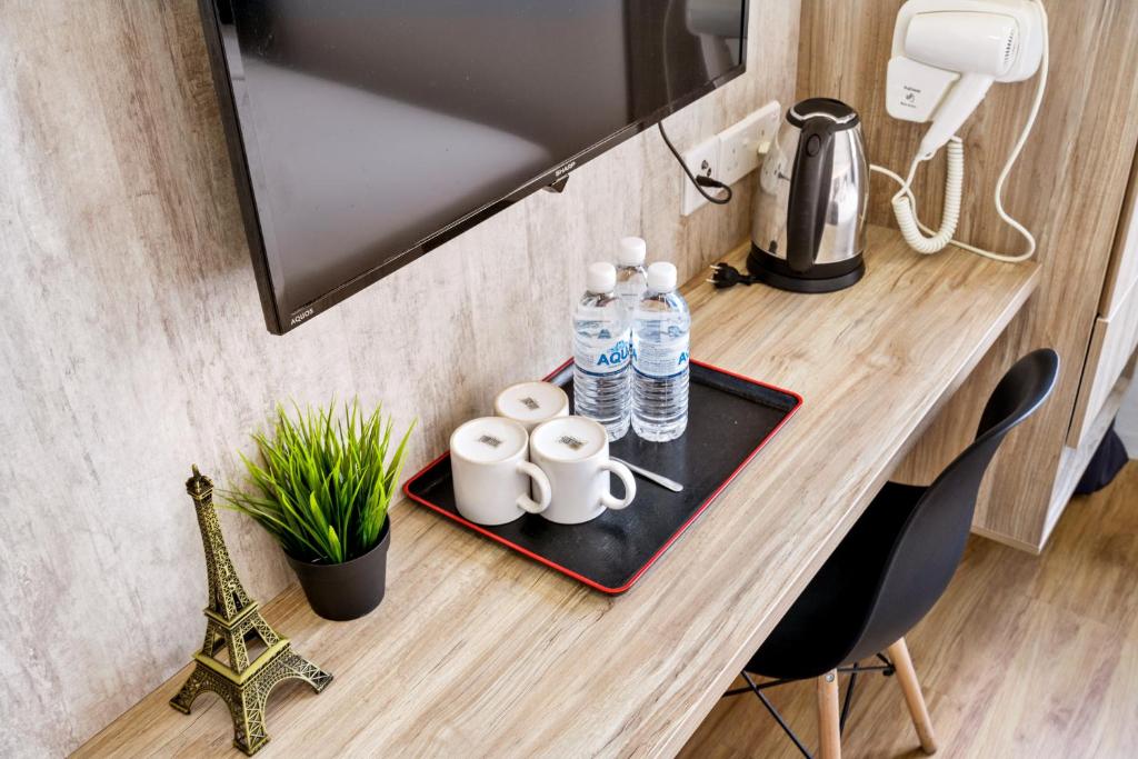 Příslušenství pro přípravu čaje a kávy v ubytování Rica Hotel Usj