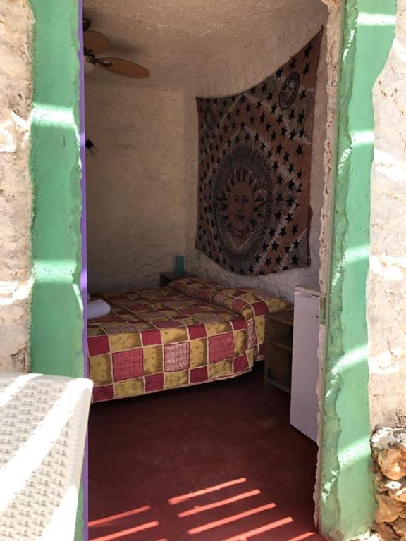 A bed or beds in a room at I Dammusi del Blu Green