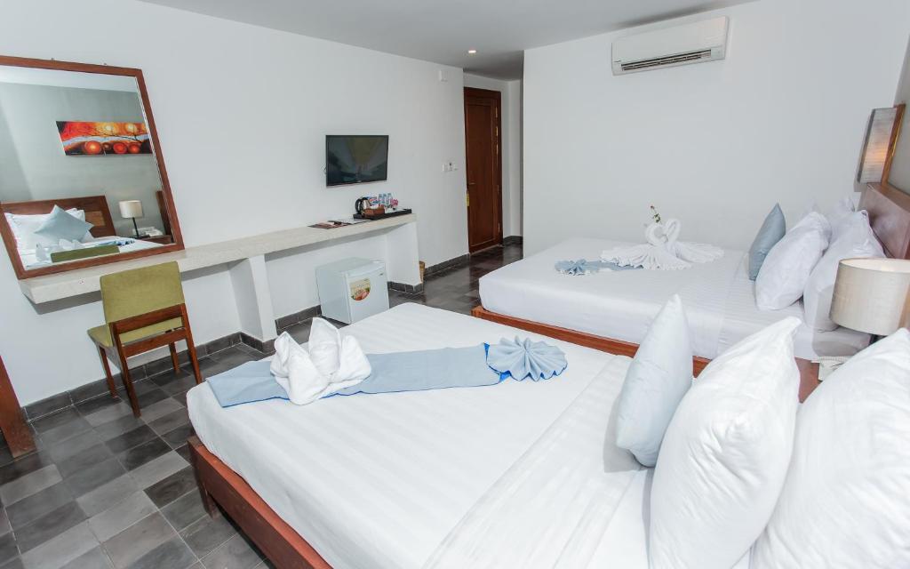 Postel nebo postele na pokoji v ubytování Home Chic Hotel