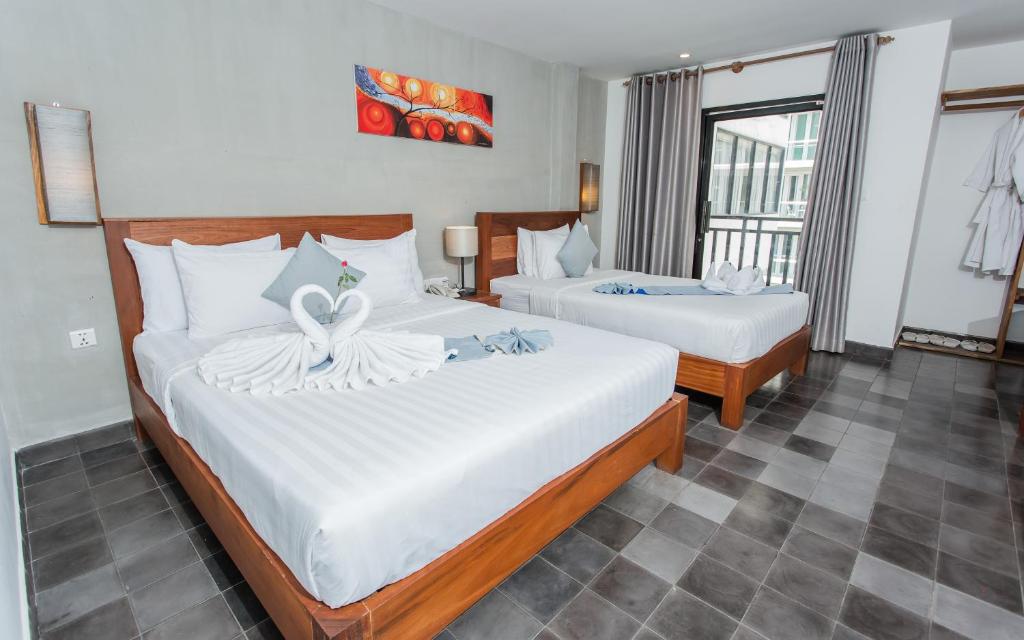 Postel nebo postele na pokoji v ubytování Home Chic Hotel