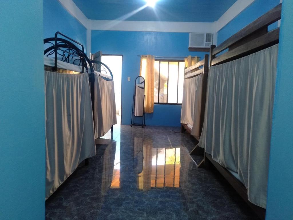Postel nebo postele na pokoji v ubytování Carillo guest house