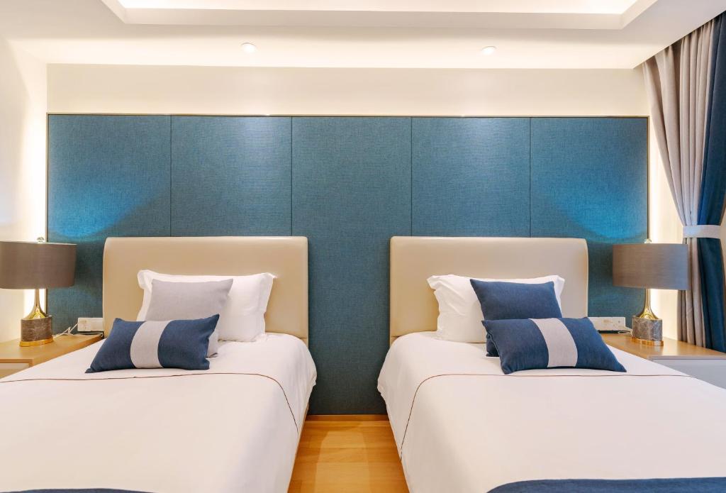 Postel nebo postele na pokoji v ubytování Hangzhou Ziwei Boutique Homestay