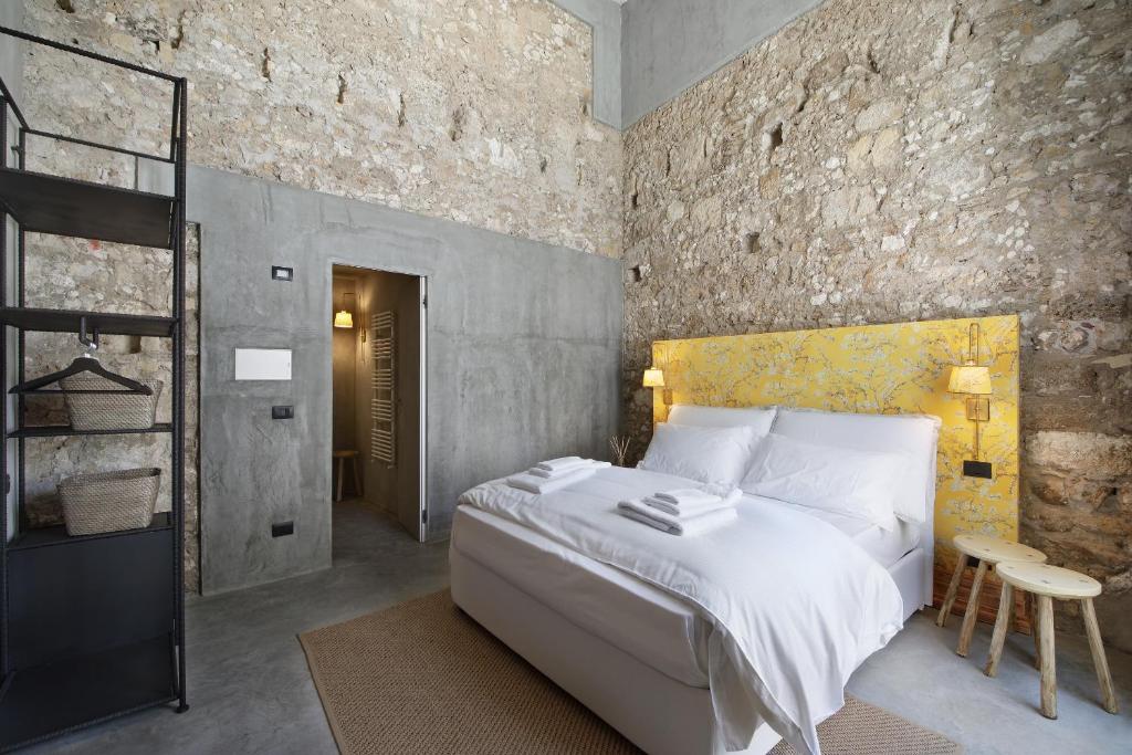 Postel nebo postele na pokoji v ubytování ISONZO SUITES