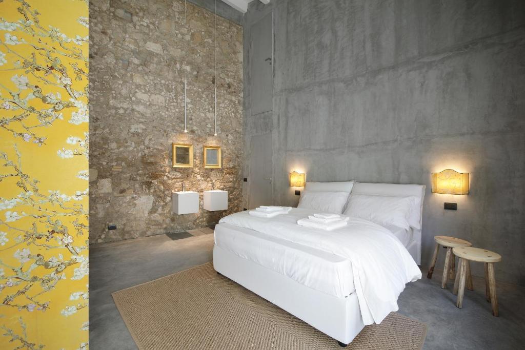 Postel nebo postele na pokoji v ubytování ISONZO SUITES