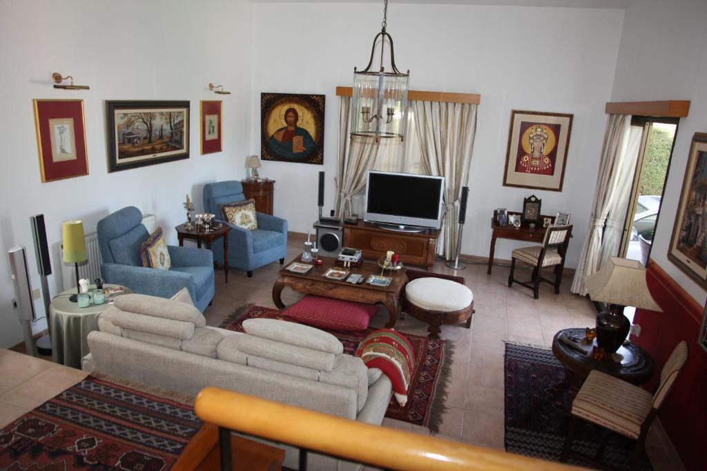 TV a/nebo společenská místnost v ubytování Residence L' Aubrais