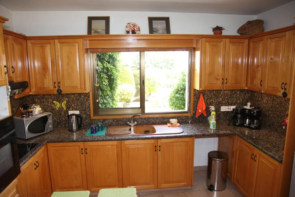 Kuchyň nebo kuchyňský kout v ubytování Residence L' Aubrais