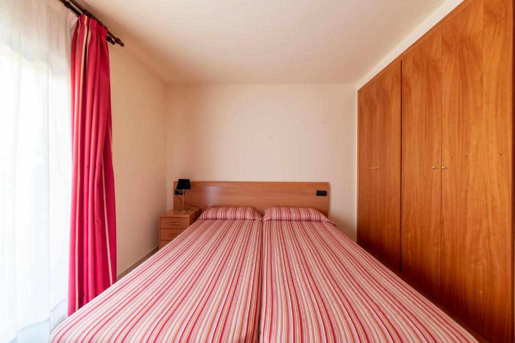 Postel nebo postele na pokoji v ubytování Golden Beach Apartamentos