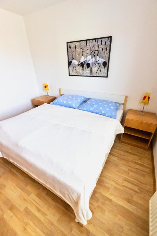 Postel nebo postele na pokoji v ubytování Apartman Hugo