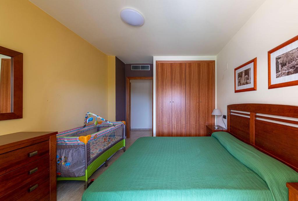 Postel nebo postele na pokoji v ubytování Golden Beach Apartamentos