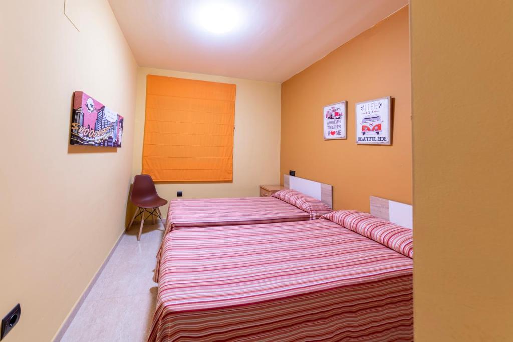 Postel nebo postele na pokoji v ubytování Golden Beach Apartamentos