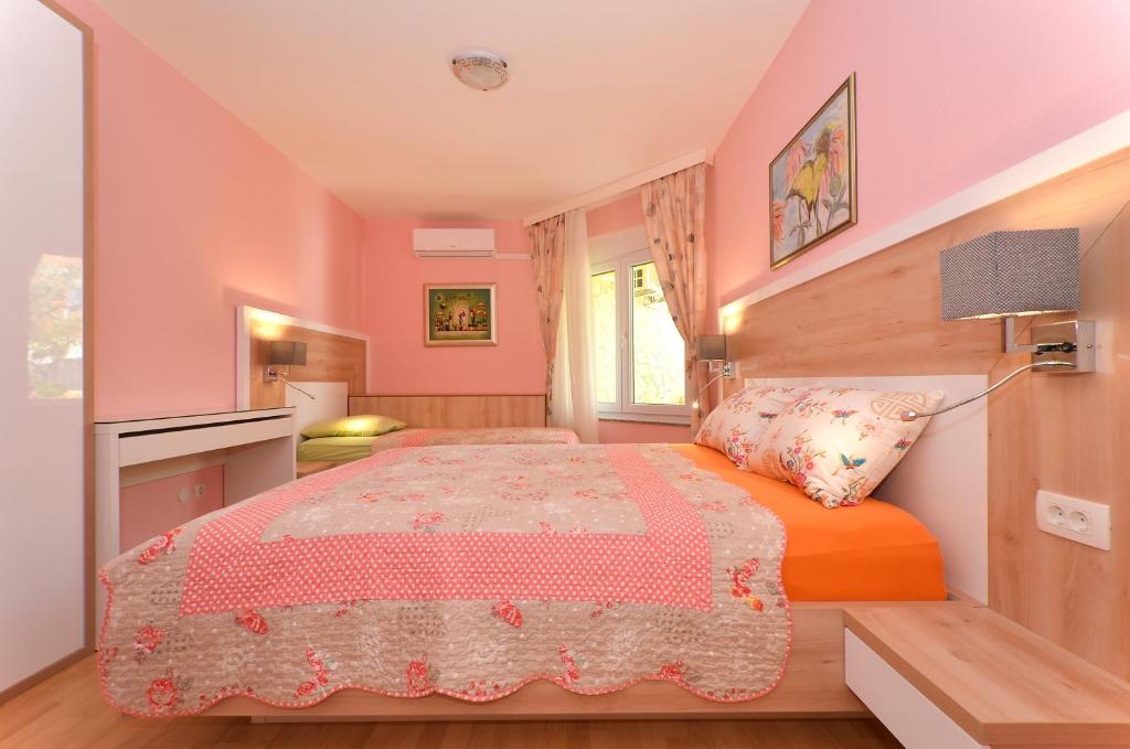Postel nebo postele na pokoji v ubytování Apartments Tomislav