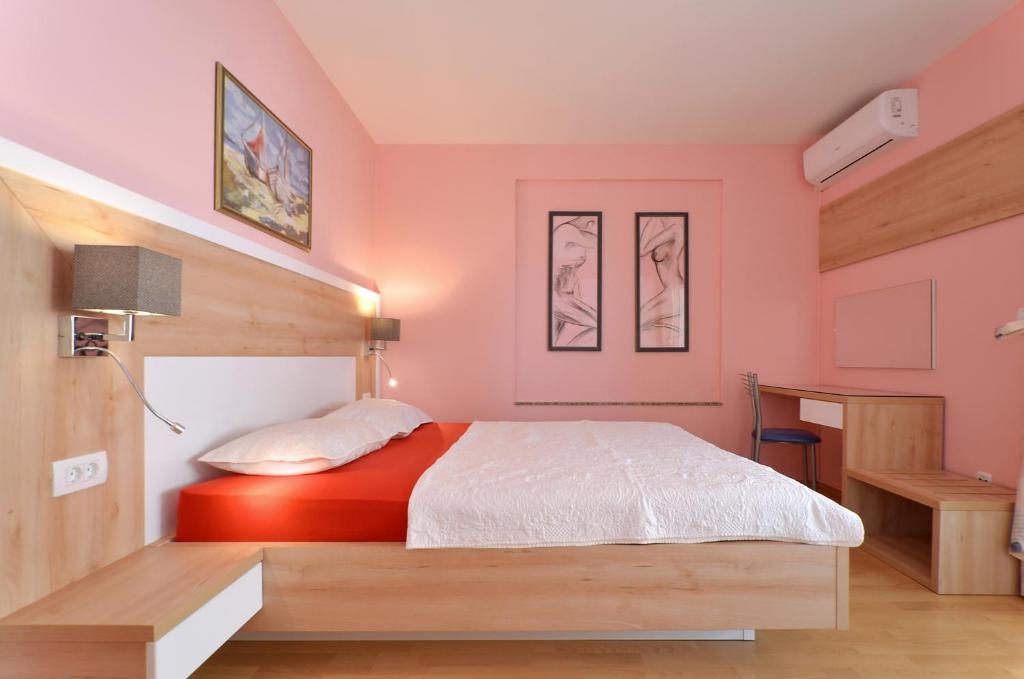 Postel nebo postele na pokoji v ubytování Apartments Tomislav