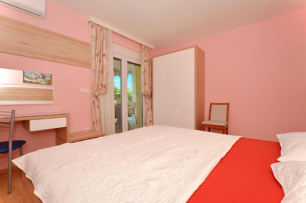 Postel nebo postele na pokoji v ubytování Apartments Tomislav