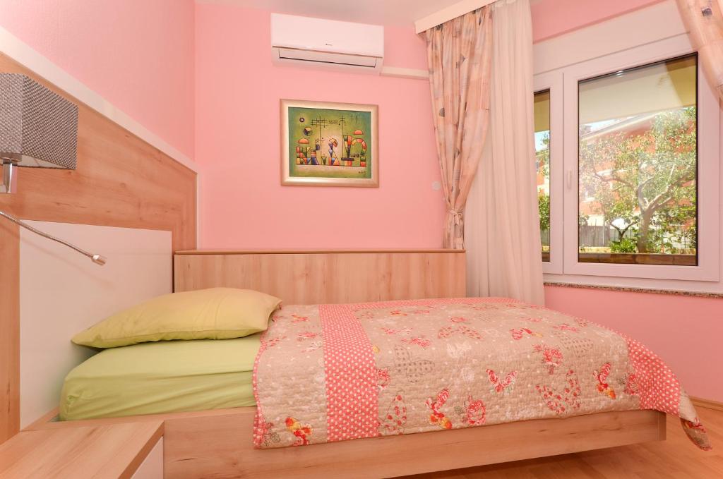 Postel nebo postele na pokoji v ubytování Apartments Tomislav