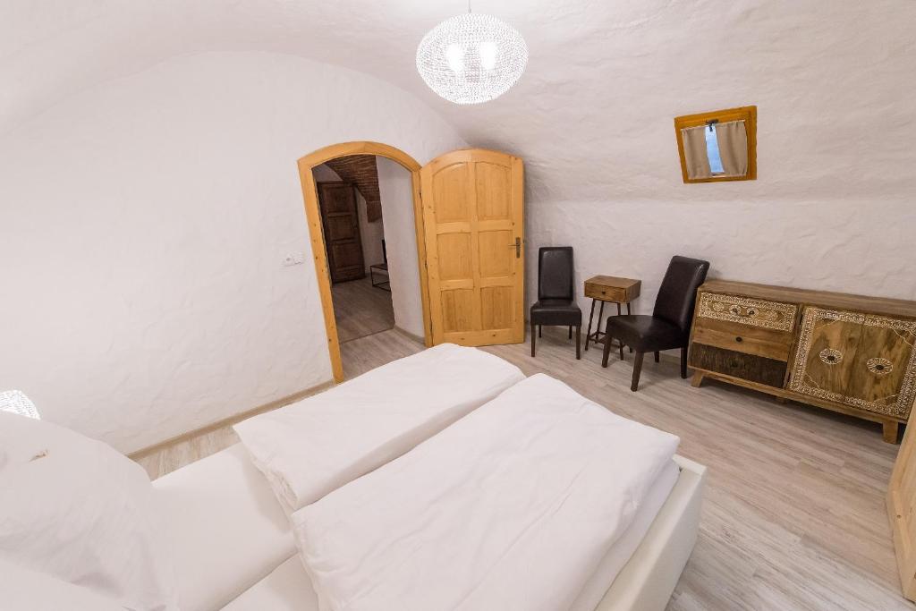 Łóżko lub łóżka w pokoju w obiekcie Pension U Zámku