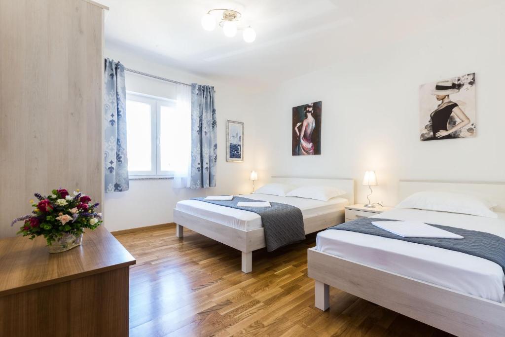 Posteľ alebo postele v izbe v ubytovaní Stine Apartment