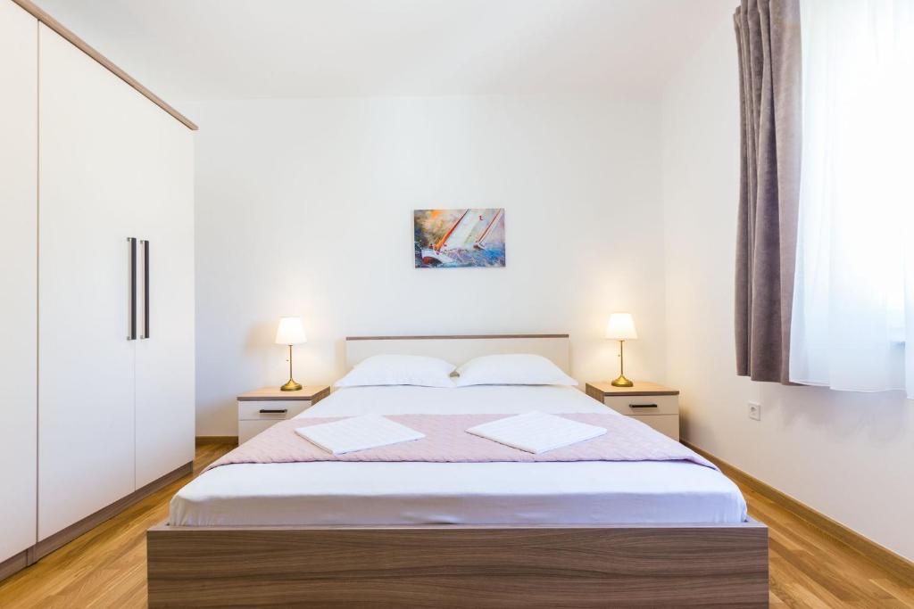 Posteľ alebo postele v izbe v ubytovaní Stine Apartment