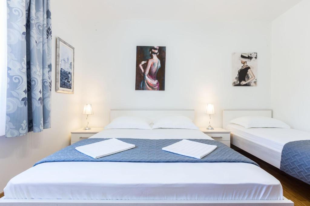 Posteľ alebo postele v izbe v ubytovaní Stine Apartment
