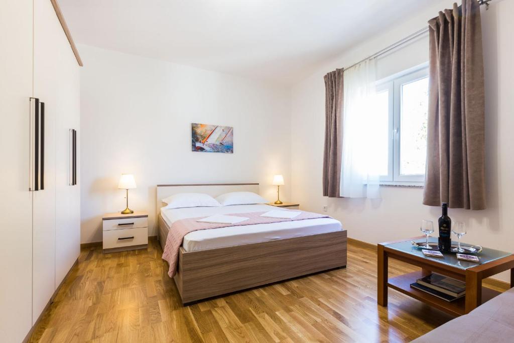 Posteľ alebo postele v izbe v ubytovaní Stine Apartment