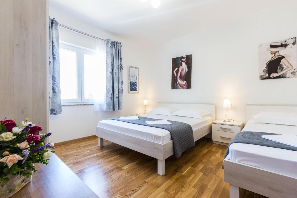 Posteľ alebo postele v izbe v ubytovaní Stine Apartment