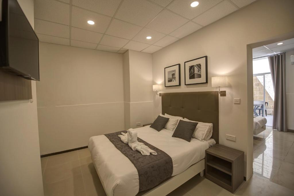 Postel nebo postele na pokoji v ubytování Europa Hotel