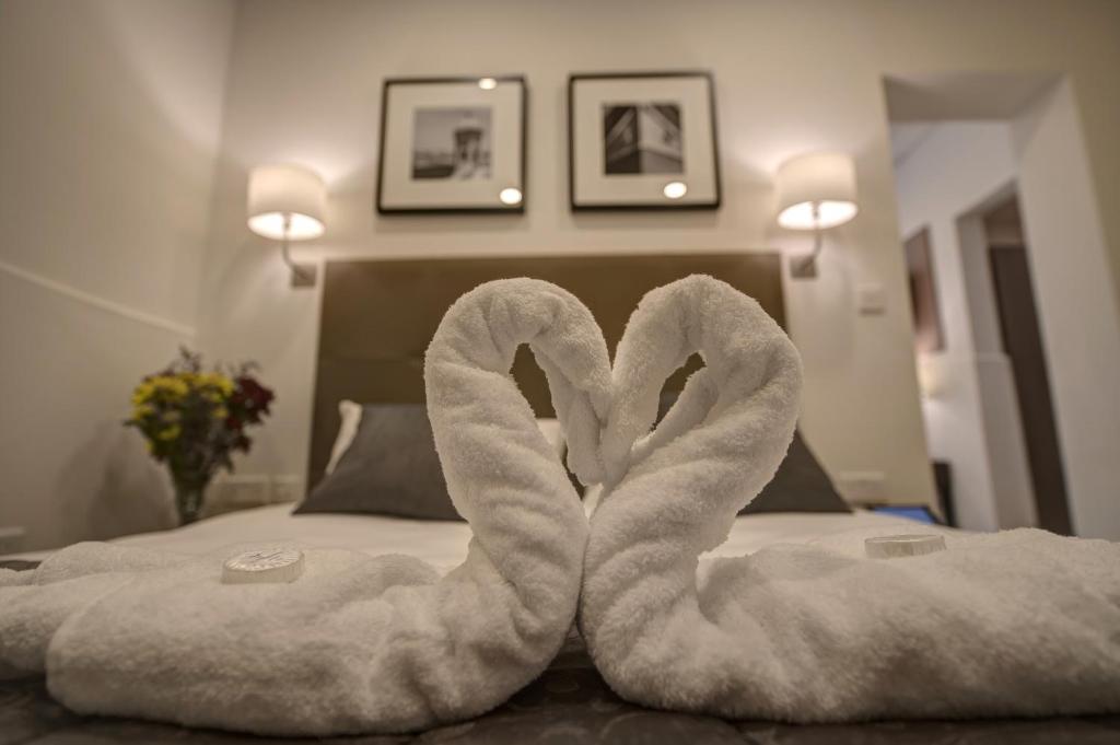 Postel nebo postele na pokoji v ubytování Europa Hotel
