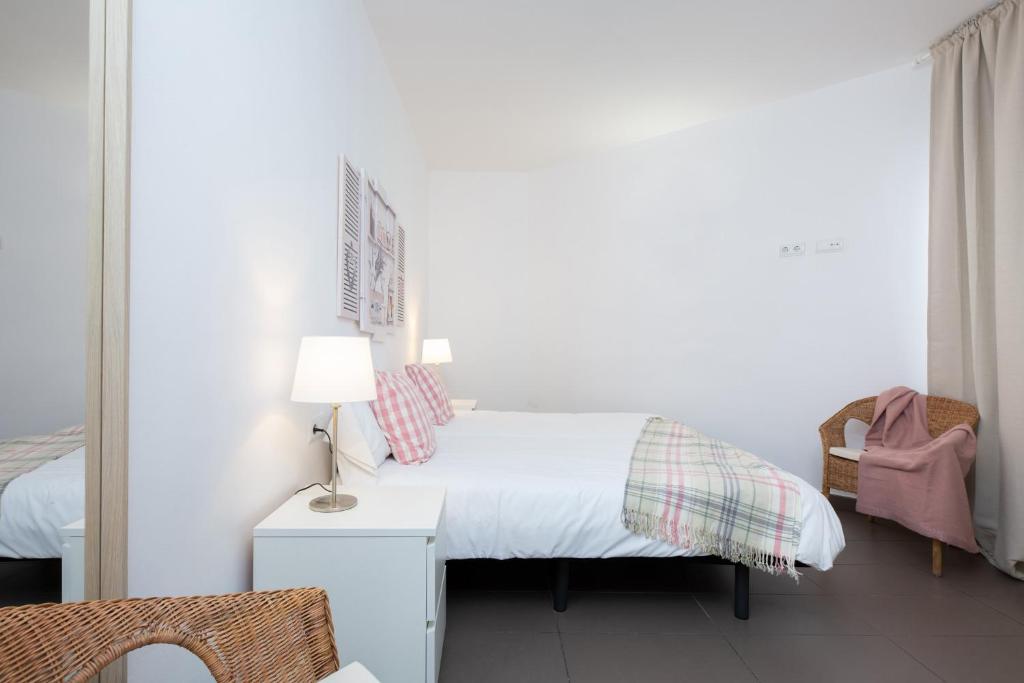 Postel nebo postele na pokoji v ubytování Apartamentos Cornellalux