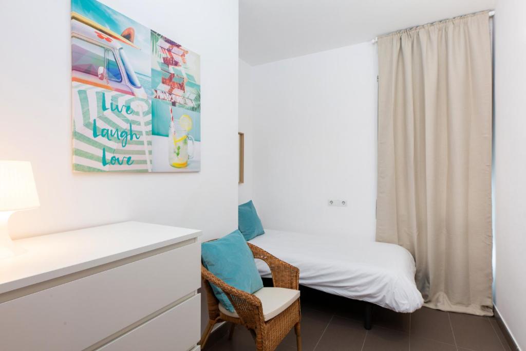 Postel nebo postele na pokoji v ubytování Apartamentos Cornellalux