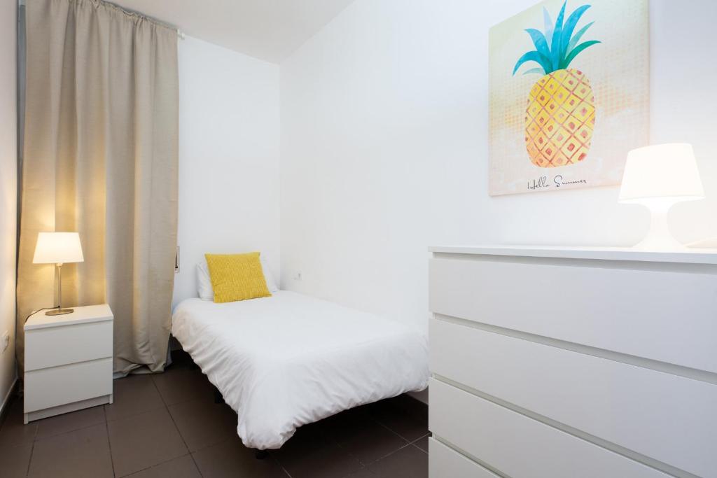 Postel nebo postele na pokoji v ubytování Apartamentos Cornellalux
