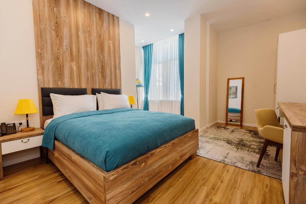 Postel nebo postele na pokoji v ubytování Boulevard Hotel Batumi