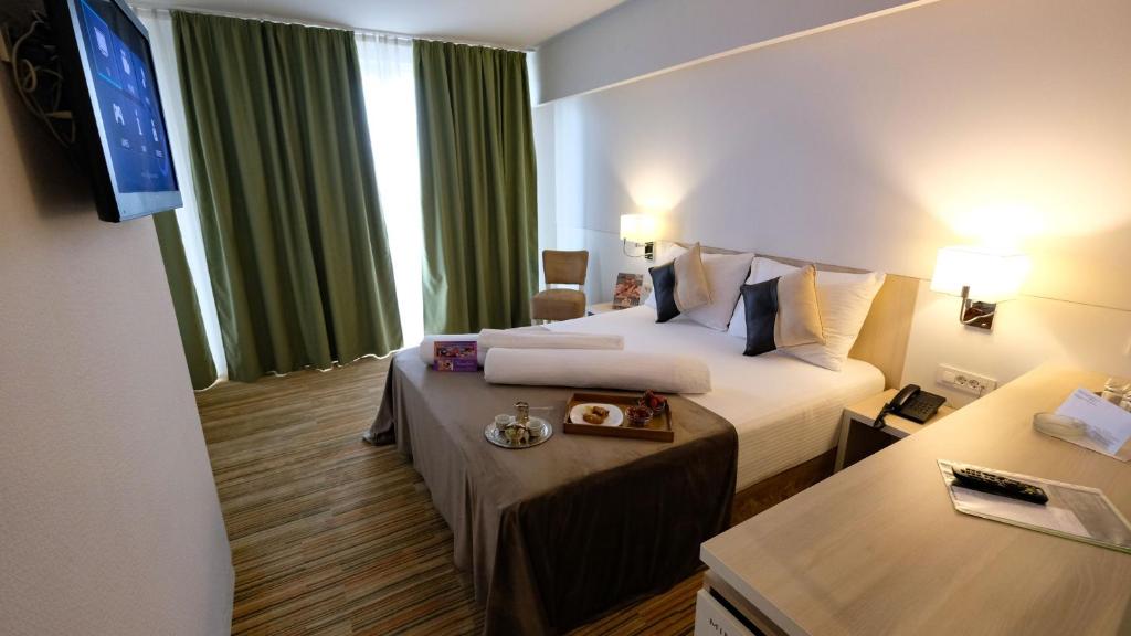 Postel nebo postele na pokoji v ubytování Hollywood Hotel