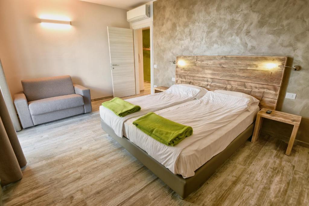 Posteľ alebo postele v izbe v ubytovaní Verdeulivo Relax Home - Ruculì Hospitality