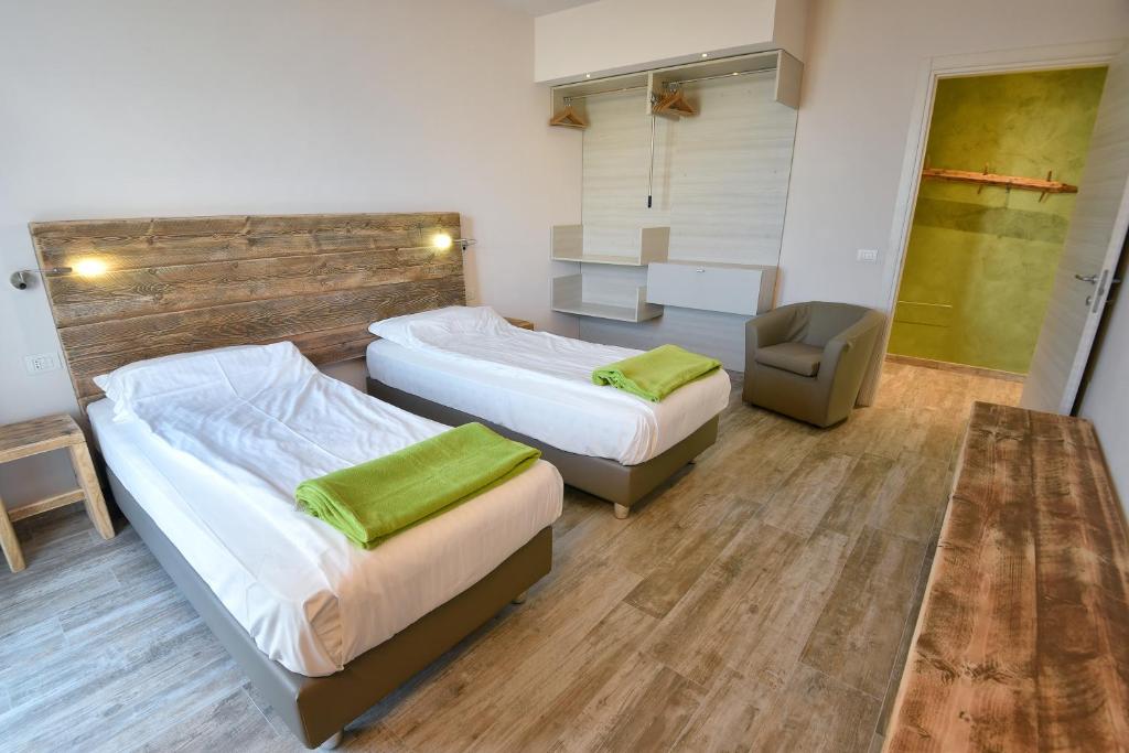 Posteľ alebo postele v izbe v ubytovaní Verdeulivo Relax Home - Ruculì Hospitality