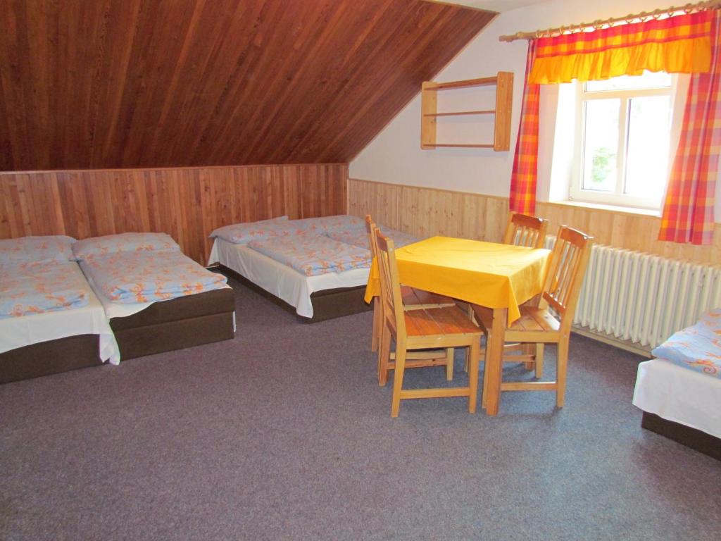 Postel nebo postele na pokoji v ubytování Chata Betyna