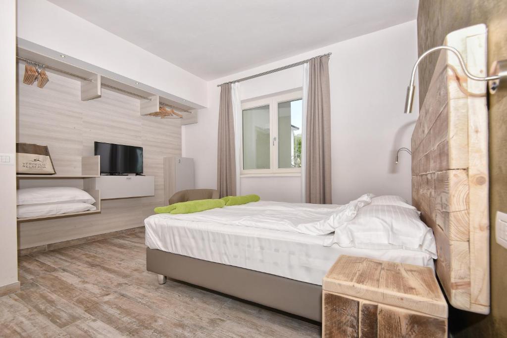 Posteľ alebo postele v izbe v ubytovaní Verdeulivo Relax Home - Ruculì Hospitality