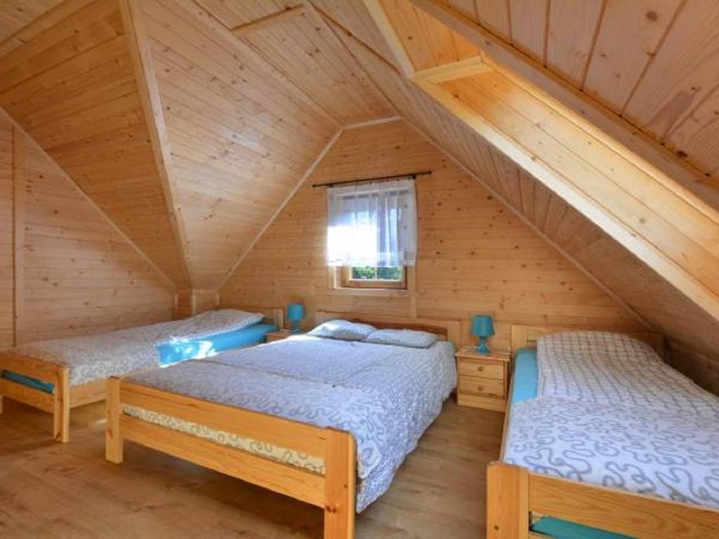 Postel nebo postele na pokoji v ubytování Domki AGA
