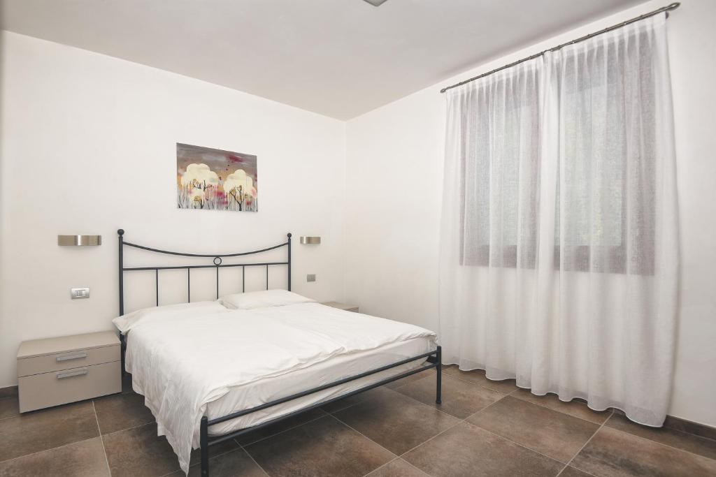 Postel nebo postele na pokoji v ubytování Les Maisons - Ruculì Hospitality