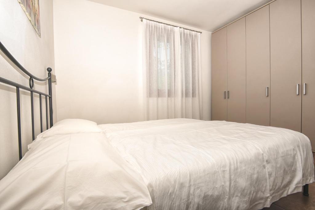 Postel nebo postele na pokoji v ubytování Les Maisons - Ruculì Hospitality