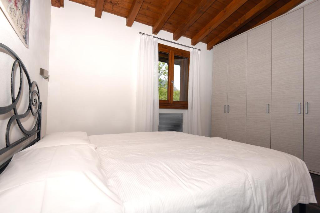 Postel nebo postele na pokoji v ubytování Les Maisons - Ruculì Hospitality