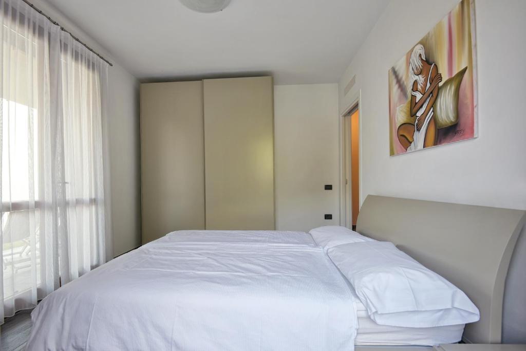 Postel nebo postele na pokoji v ubytování Les Maisons - Ruculì Hospitality